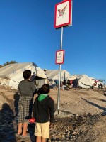 People looking at sign design for Lesbos wayfinding